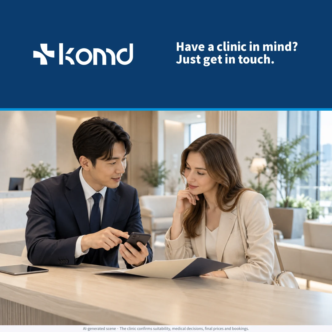 Illustrative clinic coordinator and visitor reviewing a clinic choice together; KOMD consultation connection, not an actual patient.